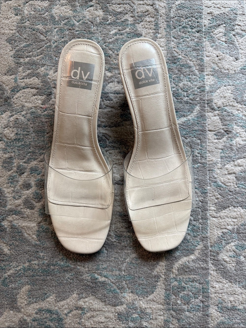 Dolce Vita White Slide Sandals with Clear Strap.